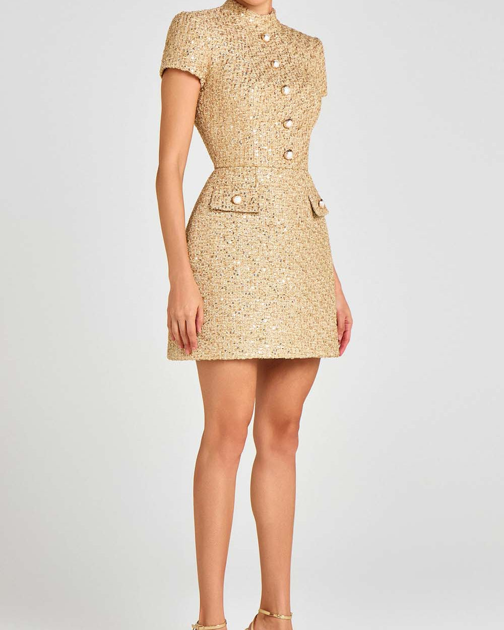 The Calypso gold bouclé mini dress in Gold